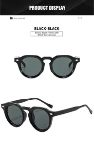 Detail view of retro round sunglasses with black frames and diamond metal rivets