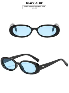 Detail of retro oval black sunglasses with blue lenses and metallic hinge accents