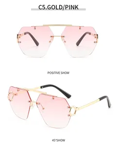 Randlose Pilotensonnenbrille mit goldenem Doppelsteg und rosa Verlaufsgläsern im Detail