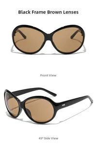Detail view of large oval black frame sunglasses with brown lenses and heart-shaped logo