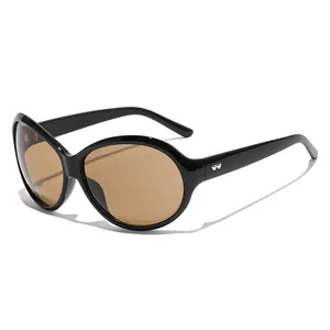Chic oversized black sunglasses with brown gradient lenses and silver temple detail