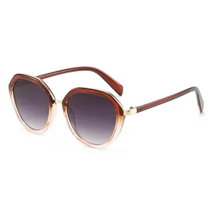 Chic oversized polygon sunglasses in amber gradient frame with gold metal hinges