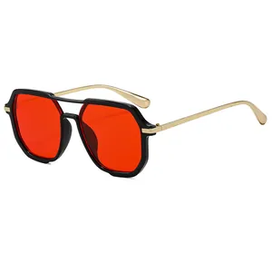 Modern square sunglasses with black frames, red lenses and gold metal double bridge