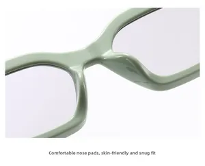 Gros plan sur les plaquettes de nez intégrées de ces lunettes de soleil vert clair