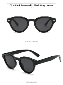 Front and side view of black vintage sunglasses with silver rivet detail and dark lenses