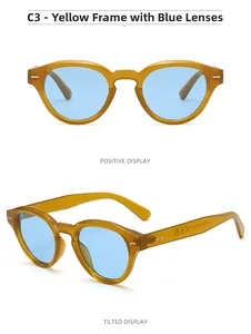 Detail of yellow oval sunglasses frame with blue lenses and metal rivet accents