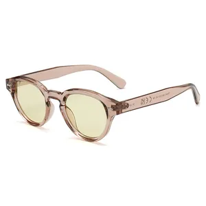 Retro round frame sunglasses with rivet accents and translucent champagne finish