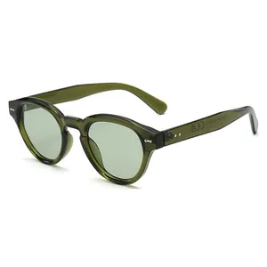 Vintage oval sunglasses with translucent green frames and rivet details at a 45-degree angle
