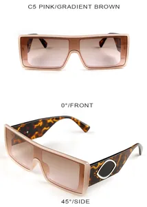 Detail view of pink square oversized sunglasses with tortoise pattern temples and metal accents