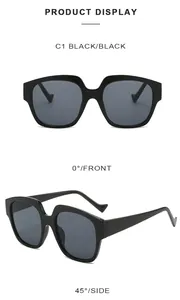 Front and 45-degree angle view of oversized black sunglasses with dark gray lenses