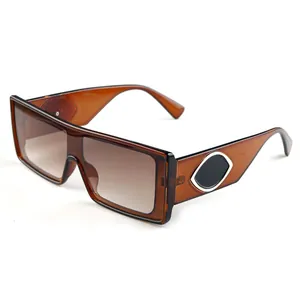 Retro square oversized amber sunglasses with brown gradient lenses and metal accents