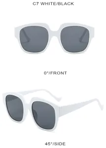 Front view of white oversized sunglasses with dark lenses and minimalist C7 frame