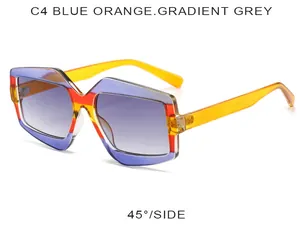 Gros plan de lunettes de soleil polygonales avec monture bleu orange et verres dégradés