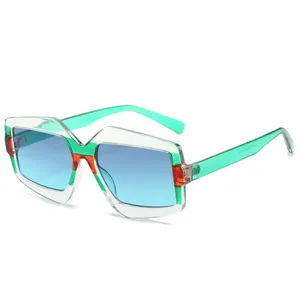 Lunettes de soleil géométriques oversize modernes avec monture verte et verres bleus