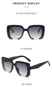 Detail of square black sunglasses with glitter frame and metal rivets on temples