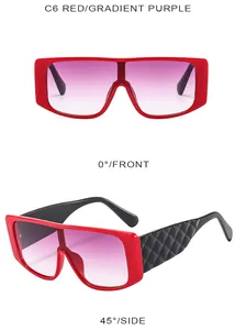Detailed view of red oversized sunglasses with gradient purple lenses and quilted temples