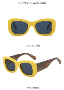 Macro view of C5 yellow oversized sunglasses with decorative tortoise shell temples