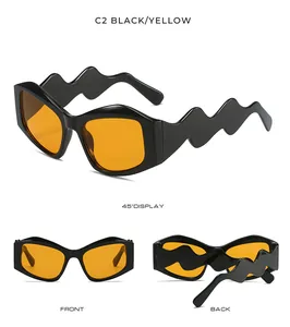 Detailed view of black irregular sunglasses with unique wavy temples and yellow lenses