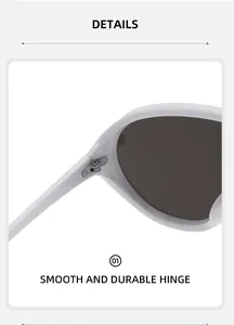 Makro-Detail des glatten robusten Metallscharniers an weißer Oversize-Sonnenbrille