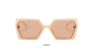 Vue de face de lunettes de soleil hexagonales dorées avec de larges branches élégantes