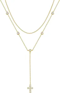 Close-up of gold layered Y-necklace featuring a zircon-studded cross pendant detail