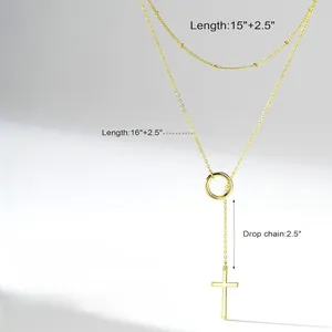 Detail view of gold layered Y-necklace showing length specs and cross pendant