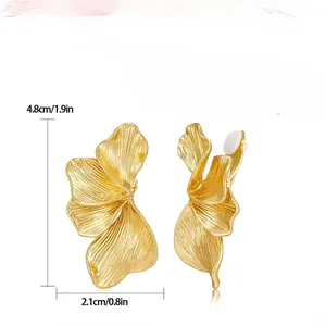 Gold textured petal earrings for women with irregular metallic layered flower design