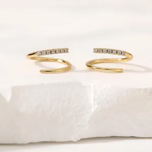 Elegant gold spiral cartilage hoop earrings with sparkling crystal accents