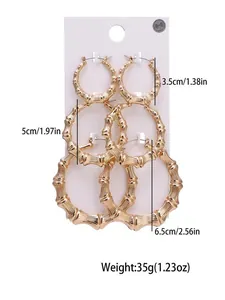 Close-up of three pairs of vintage gold bamboo hoop earrings in 3.5cm 5cm and 6.5cm sizes