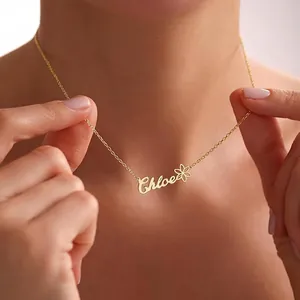 Close-up of personalized gold-plated name necklace featuring Chloe with a small flower