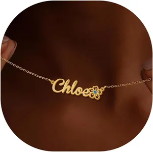 Close-up of personalized Chloe name necklace with flower charm and blue gemstone detail