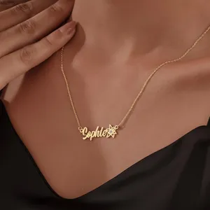Close-up of personalized gold-plated Sophie name necklace with flower and small zircon