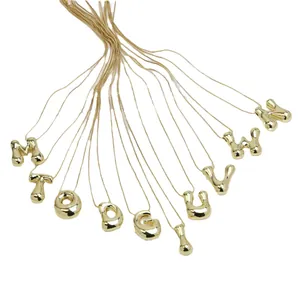 Gold plated brass bubble letter necklace with high-gloss liquid puff pendant style