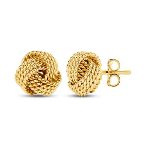Detail of gold-plated brass stud earrings featuring a textured twisted rope ball design