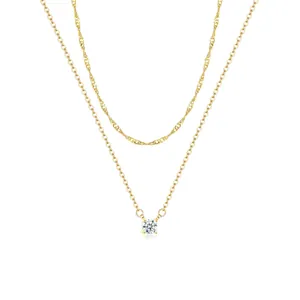 Double layered gold plated brass necklace with sparkling cubic zirconia solitaire pendant
