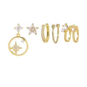 Set di 5 orecchini e ear cuff dorati con pendenti a stella e zirconi cubici scintillanti