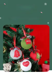 Detailed knitted Christmas ball set with festive felt patches on a tree branch