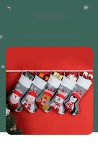 Detail of five Christmas stockings featuring Santa, reindeer, and snowman characters