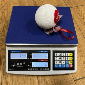 Lightweight white knitted Christmas ball with red Happy heart patch weighing 13.3g