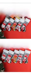 Detail of five Nordic style knitted Christmas stockings with 3D cartoon animal characters