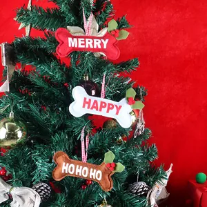 Three bone-shaped felt Christmas tree ornaments with festive text and checkered strings