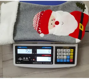 Detailed view of a grey Christmas stocking with Santa Claus patchwork weighing 75.0g