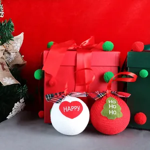 Festive Christmas knitted hanging balls with embroidered Happy and Ho Ho Ho patterns