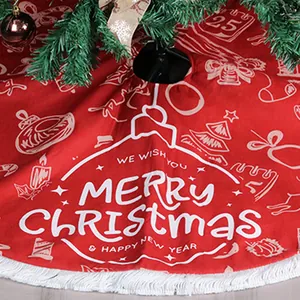 Red Christmas tree skirt with white tassels and festive Merry Christmas print decoration
