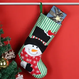 Christmas stocking with snowman applique and green striped pattern for holiday home decor