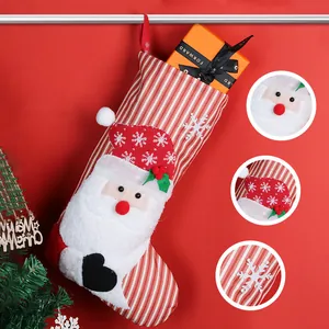 Christmas stocking with 3D Santa Claus and red white stripes for home festive decoration