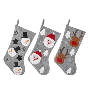 Set of 3 grey felt Christmas stockings with 3D Santa, Snowman, and Reindeer designs