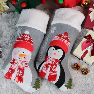 Christmas stockings set with snowman and penguin patterns on grey felt and faux fur trim