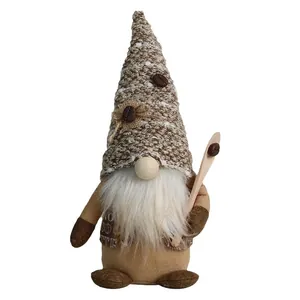 Coffee gnome plush decor with tall knitted hat, white beard, and small wooden coffee spoon