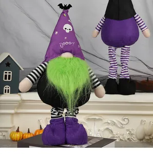 Detail of Halloween gnome with long green beard and bat pattern hat on mantelpiece